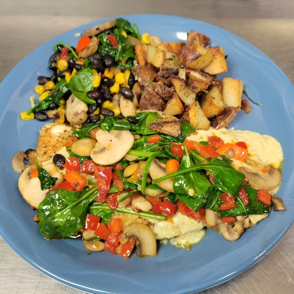 Osorio's Latin Fusion dish with chicken, spinach, mushrooms, roasted potatoes, and black bean corn salsa.