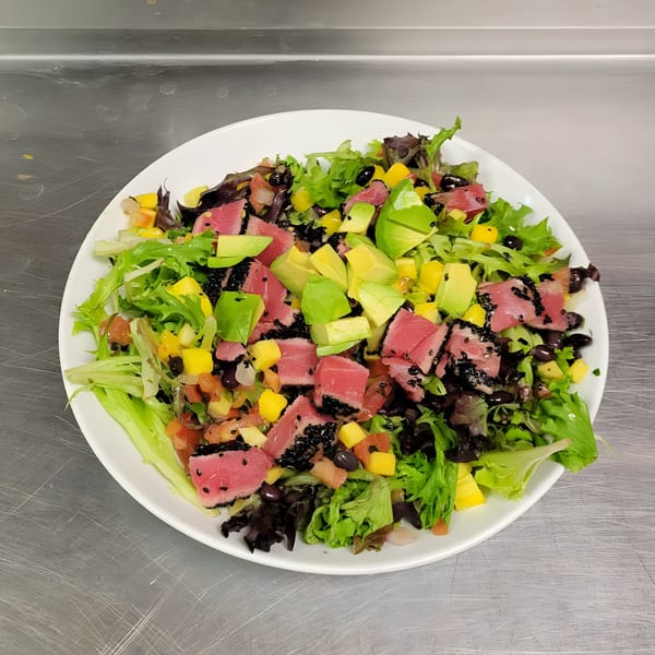 Osorio's Latin Fusion tuna salad with mixed greens, avocado, mango, black beans, and sesame seeds.